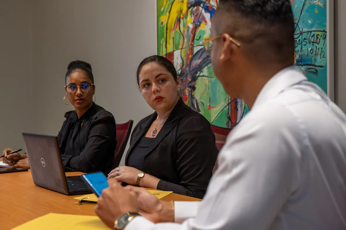 AZERRA advisors in a client consultation at the Paramaribo office